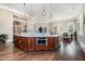 Kitchen with marble island, stainless appliances, and dark wood cabinets, creating a stylish and functional space at 1428 Wrenn Rd, Durham, NC 27703