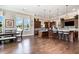 Open-concept kitchen with a large island, pendant lighting, and dining area creating a warm and inviting space at 1428 Wrenn Rd, Durham, NC 27703