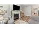 Comfortable living room with a decorative fireplace, creating a cozy and inviting atmosphere at 1428 Wrenn Rd, Durham, NC 27703