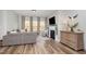 Bright living room featuring a fireplace, hardwood floors, and plenty of natural light at 1428 Wrenn Rd, Durham, NC 27703