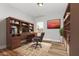 Well-appointed office space featuring a built-in desk and ample shelving at 1428 Wrenn Rd, Durham, NC 27703
