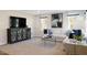 Bright living room featuring plush seating, modern decor, and a stylish entertainment center at 2349 Stephens Pass Sta, Apex, NC 27502
