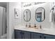 Modern bathroom with double vanity, stylish mirrors, subway tile backsplash, and brushed nickel fixtures at 2422 Castleburg Dr, Apex, NC 27523
