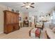 Spacious living room with a large cabinet, view into the kitchen, and comfortable seating arrangement at 2422 Castleburg Dr, Apex, NC 27523
