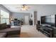 Spacious living room with a television, desk, and comfortable seating at 2422 Castleburg Dr, Apex, NC 27523