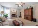 Comfortable living room with a brick fireplace, windows for light, and a large cabinet for storage at 2422 Castleburg Dr, Apex, NC 27523