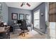 Home office with grey walls, ceiling fan, computer, framed artwork, and a window for plenty of natural light at 2422 Castleburg Dr, Apex, NC 27523