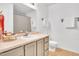 Classic bathroom design with a sink, toilet, shower with neutral-toned flooring and cabinetry at 2602 Hitchcock Dr, Durham, NC 27705
