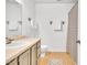Standard bathroom featuring a sink, toilet, shower with neutral-toned flooring and cabinetry at 2602 Hitchcock Dr, Durham, NC 27705