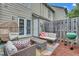 Cozy patio with wicker furniture, grill and decorative concrete with backyard access at 2602 Hitchcock Dr, Durham, NC 27705