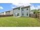 Spacious backyard featuring a well-maintained lawn, patio, and fenced perimeter at 267 Dando St, Garner, NC 27529