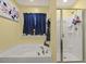 Bright bathroom features a soaking tub, separate glass shower, and decorative accents at 267 Dando St, Garner, NC 27529