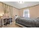 Cozy bedroom featuring natural light, neutral tones, and charming decorative vines at 267 Dando St, Garner, NC 27529