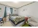 Bright bedroom with a window, cozy seating area, and decorative plant wall art at 267 Dando St, Garner, NC 27529