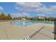 Inviting community pool area surrounded by lush greenery and featuring multiple swimming zones at 267 Dando St, Garner, NC 27529