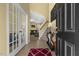 Inviting foyer with tile flooring, staircase, and decorative console table at 267 Dando St, Garner, NC 27529