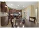 Kitchen featuring dark wood cabinets, stainless steel appliances, and a central island with seating at 267 Dando St, Garner, NC 27529