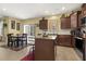 Spacious kitchen with a breakfast bar, stainless appliances, and adjacent dining area at 267 Dando St, Garner, NC 27529