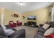 Comfortable living room with plush seating, large TV and cozy decor at 267 Dando St, Garner, NC 27529