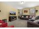 Comfortable living room with plush seating, large TV and cozy decor at 267 Dando St, Garner, NC 27529