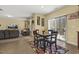 Open concept living area with sliding glass doors to the outside and tile flooring at 267 Dando St, Garner, NC 27529
