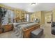 Bedroom featuring warm paint, multiple windows with curtains, television, dresser, and nightstand at 267 Dando St, Garner, NC 27529