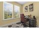 Bright home office with neutral walls, natural light, and comfortable seating at 267 Dando St, Garner, NC 27529