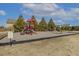 Community playground with swings, slides, and climbing structures for enjoyment at 267 Dando St, Garner, NC 27529