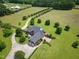 A sprawling estate with a well-maintained lawn, mature landscaping, and a secluded home with ample space at 280 Phillips Rd, Selma, NC 27576