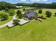 Spacious property with a well-manicured lawn, attached garage, and beautiful landscaping surrounding the home at 280 Phillips Rd, Selma, NC 27576