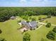 Stunning property showcasing a brick home, separate garage, manicured lawns, and elegant landscaping at 280 Phillips Rd, Selma, NC 27576