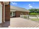 Large back deck with white railings overlooks a lush green backyard and blue skies at 280 Phillips Rd, Selma, NC 27576