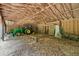 Large barn with tractor inside, exposed beams, and dirt floor at 280 Phillips Rd, Selma, NC 27576