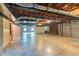 Spacious unfinished basement with concrete floor, brick fireplace, and exposed ceiling at 280 Phillips Rd, Selma, NC 27576