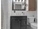 Updated bathroom featuring a black vanity with white countertop and tiled walls at 280 Phillips Rd, Selma, NC 27576