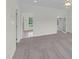 Spacious bedroom with neutral carpet and walls, features a walk-in closet at 280 Phillips Rd, Selma, NC 27576
