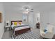 Cozy bedroom featuring a ceiling fan, a warm wood bed frame, and a calming color scheme at 280 Phillips Rd, Selma, NC 27576