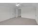 Bright bedroom with soft carpet, a ceiling fan, and a view into the next room at 280 Phillips Rd, Selma, NC 27576