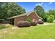 Charming brick home with manicured landscaping and well-maintained lawn at 280 Phillips Rd, Selma, NC 27576