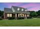 Charming brick home with a welcoming front porch, well-maintained landscaping, and a beautifully manicured lawn at 280 Phillips Rd, Selma, NC 27576