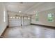 Spacious two-car garage with automatic doors and ample natural light at 280 Phillips Rd, Selma, NC 27576
