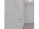 Hallway featuring a door and a carpeted floor at 280 Phillips Rd, Selma, NC 27576