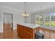 Kitchen island with natural light coming in through windows, and wood cabinets at 280 Phillips Rd, Selma, NC 27576