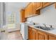 A laundry room includes side by side washer and dryer, storage, and a sink at 280 Phillips Rd, Selma, NC 27576