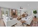 Bright living room features hardwood floors, a brick fireplace, and an open layout perfect for entertaining at 280 Phillips Rd, Selma, NC 27576