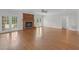Living room features hardwood floors, a brick fireplace, and doors leading to the outdoor space at 280 Phillips Rd, Selma, NC 27576