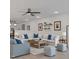 Staged living room featuring a large sofa, neutral colors, and recessed lighting at 280 Phillips Rd, Selma, NC 27576