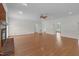 Spacious living room with hardwood floors, fireplace, and multiple doorways, offering versatile layout options at 280 Phillips Rd, Selma, NC 27576