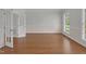 Spacious living room with natural light and hardwood floors, enhanced by classic trim work at 280 Phillips Rd, Selma, NC 27576