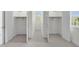 Dual walk-in closets featuring individual windows and closet rods at 280 Phillips Rd, Selma, NC 27576